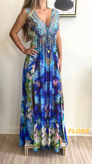 Color: Flore Shahida Parides Plunge Dress, Dark blue, light blue, and green floral pattern with beading on neckline